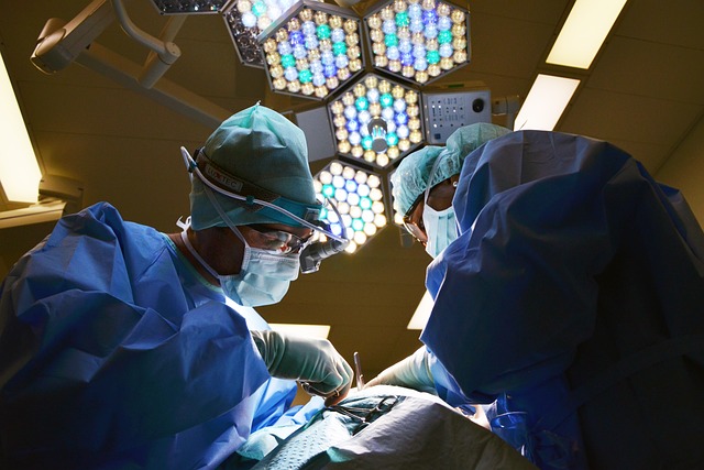 Surgeons performing a surgical procedure under bright surgical lights at Riverside Cardiology Associates