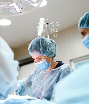 Surgical team performing a procedure under operating lights at Riverside Cardiology Associates