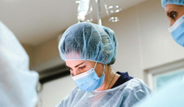 Surgical team performing a procedure under operating lights at Riverside Cardiology Associates